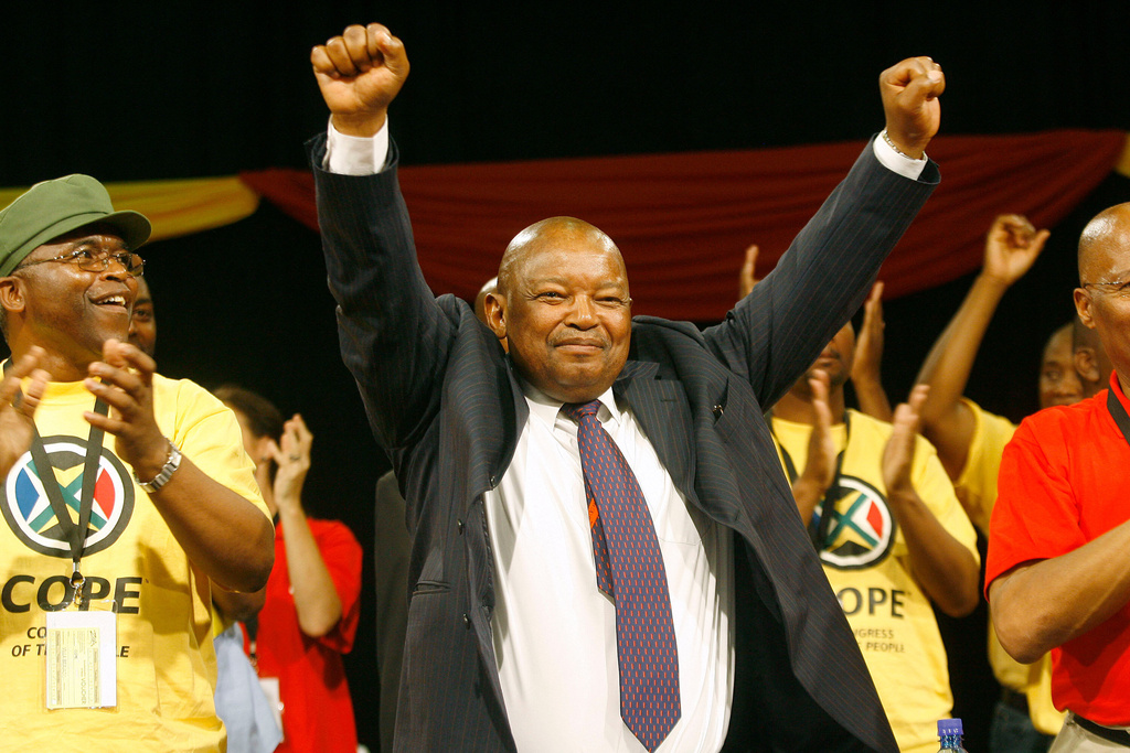 FILE -Mosiuoa Lekota, a former defense minister and co-founder of Cope (Congress of the People), breakaway faction of South Africa's African National Congress, reacts, as he is named the leader of the new party, at the final session of Cope's three-day founding conference in Bloemfontein, South Africa, Dec. 16, 2008. (AP Photo/Jerome Delay, File)