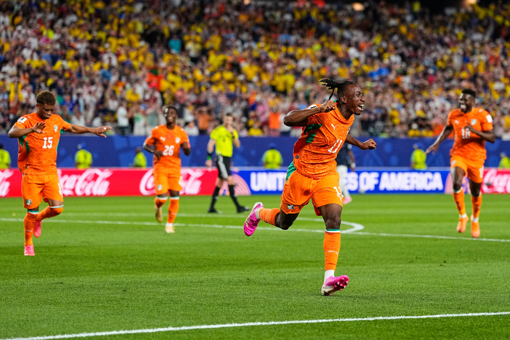 Ivory Coast's Yan Diomande (11) celebrates after teammate Amad Diallo (15) scored their first goal during the World Cup Group E soccer match between Ivory Coast and Ecuador in Philadelphia, Sunday, June 14, 2026. (AP Photo/Petr David Josek)