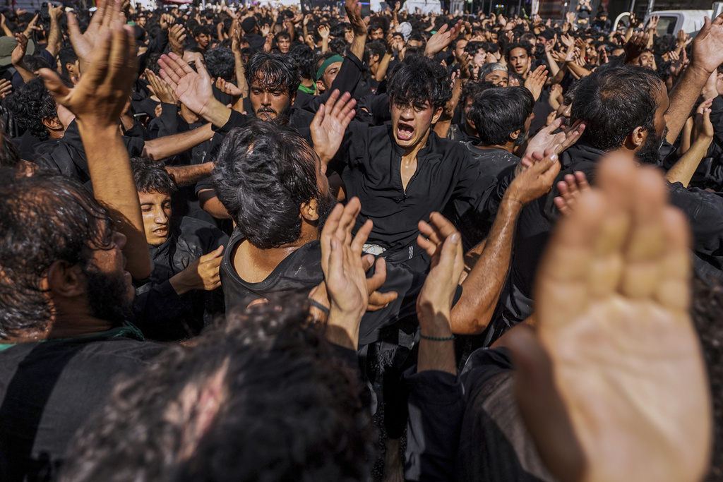 Shiite pilgrims participate in Arbaeen, which marks the end of the 40-day mourning period following Ashoura, in Karbala, Iraq, Thursday, Aug. 14, 2025. (AP Photo/Ammar Khalil)