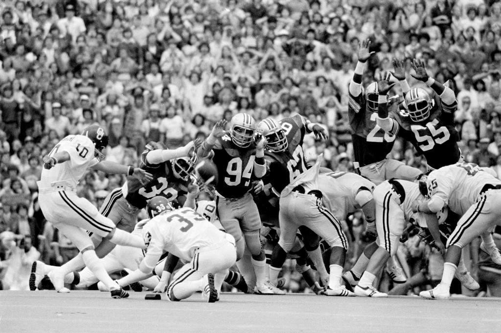 FILE - In this Sept. 24, 1977, file photo, Oklahoma's Uwe von Schamann kicks a field goal past Ohio State defenders Kelton Dansler (32), David Adkins (94) and Eddie Beamon (67) in the closing seconds to give Oklahoma a 29-28 win in an NCAA college football game in Columbus, Ohio. (AP Photo, File)