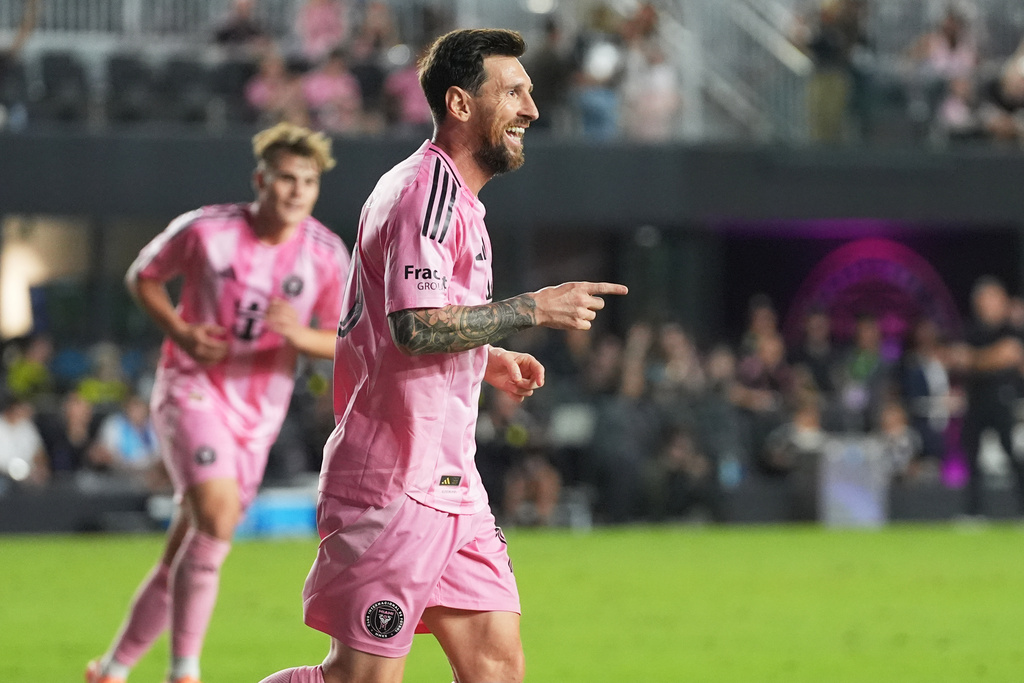 Inter Miami forward Lionel Messi (10) reacts after scoring a goal during the second half of match one of an MLS playoff opening round soccer match against the Nashville SC, Friday, Oct. 24, 2025, in Fort Lauderdale, Fla. (AP Photo/Marta Lavandier)