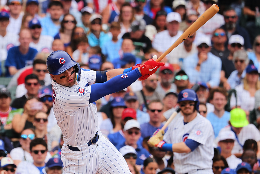 Chicago Cubs' Nico Hoerner hits an RBI single during the first inning of a baseball game against the St. Louis Cardinals, Sunday, July 5, 2026, in Chicago. (AP Photo/Melissa Tamez)