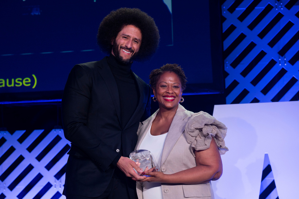Colin Kaepernick, left, is presented with the ACLU Ralph Ellison Award for Defenders of Civil Rights and Civil Liberties in the Arts, Business, Science, and Sports by Deborah Archer at the ACLU's 2026 Biennial Leadership Conference,Friday, July 24, 2026, in Washington. (AP Photo/Kevin Wolf)