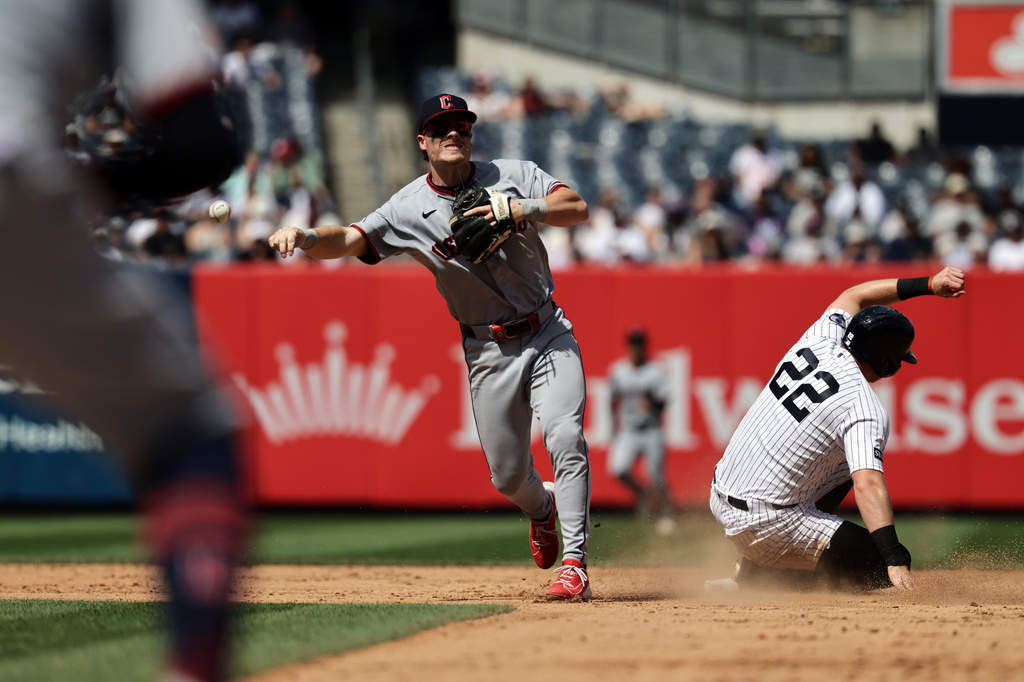 Cleveland Guardians second baseman Travis Bazzana throws to first after getting a force out on New York Yankees' Benb Rice to complete the double play on Paul Goldschmidt at first base during the sixth inning of a baseball game Thursday, June 4, 2026, in New York. (AP Photo/Adam Hunger)