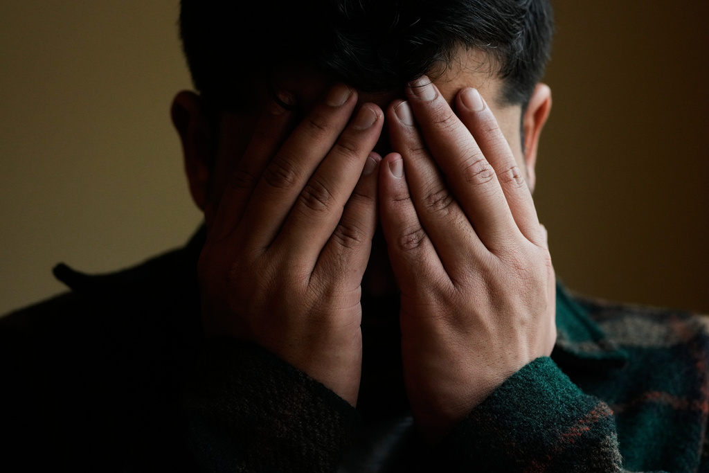 Rohullah R., who did not want his face to be shown or to disclose his last name out of fear of ICE, is photographed at his home in North Highlands, Calif., Friday, Dec. 5, 2025. (AP Photo/Godofredo A. Vásquez)