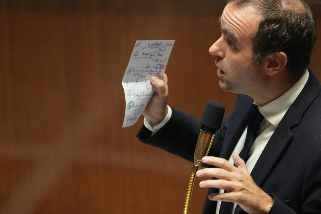 French Prime Minister Sebastien Lecornu answers lawmakers after his policy speech at the National Assembly, Tuesday, Oct. 14, 2025 in Paris. (AP Photo/Thibault Camus)