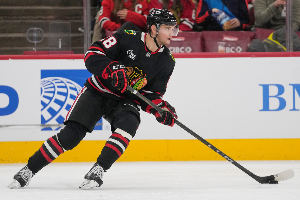 FILE - Chicago Blackhawks left wing Andre Burakovsky controls the puck during the second period of an NHL hockey game against the Washington Capitals, Jan. 9, 2026, in Chicago. (AP Photo/Erin Hooley, File)