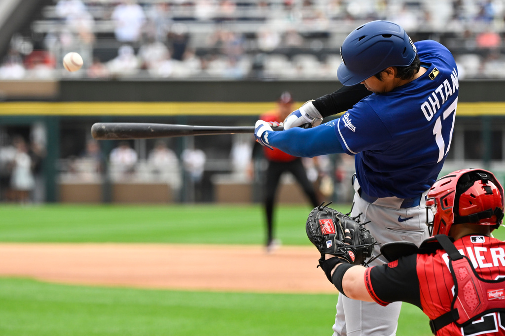 Los Angeles Dodgers' Shohei Ohtani (17), of Japan, hits a home run during the first inning of a baseball game against the Chicago White Sox, Saturday, June 13, 2026, in Chicago. (AP Photo/Matt Marton)