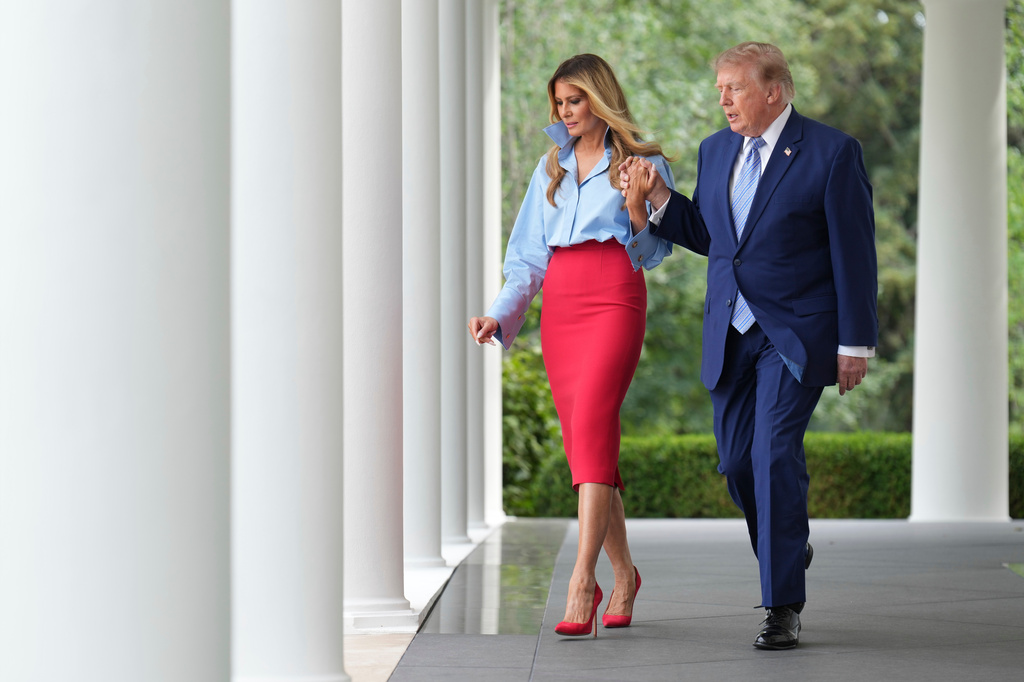 President Donald Trump, right, and first lady Melania Trump walk to attend an event in the Rose Garden of the White House, Thursday, Aug. 20, 2026, in Washington. (AP Photo/Jacquelyn Martin)