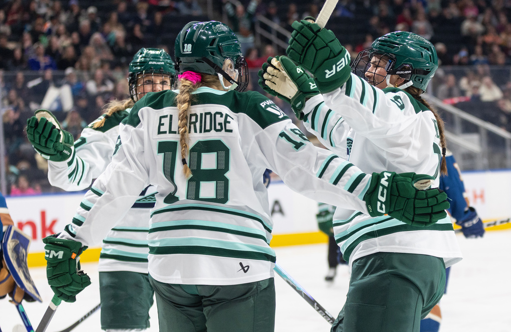 Boston Fleet's Shay Maloney (left), Jessie Eldridge (18) and Sophie Shirley (9) celebrate a goal against the Vancouver Goldeneyes during second period PWHL hockey action in Edmonton on Tuesday, April 7, 2026. (Jason Franson/The Canadian Press via AP)