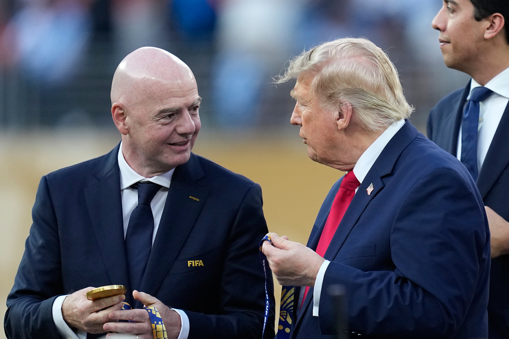 President Donald J. Trump speaks with FIFA President Gianni Infantino during the awards ceremony at the end of the World Cup final soccer match between Spain and Argentina in East Rutherford, N.J., near New York, Sunday, July 19, 2026. (AP Photo/Ashley Landis)