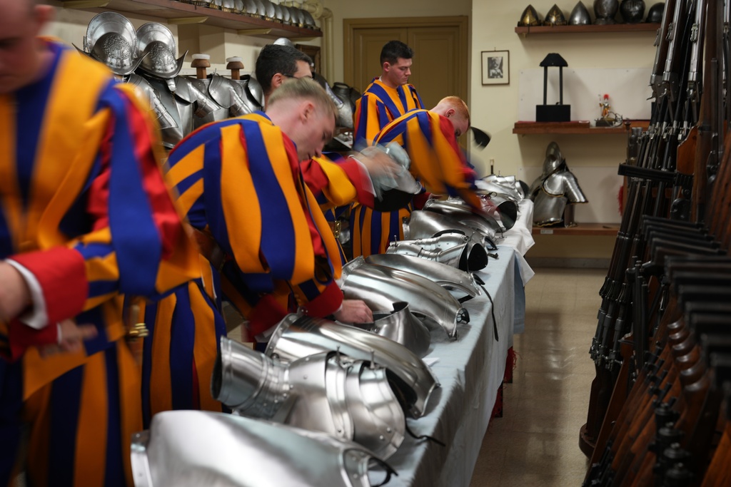 Pontifical Swiss Guards prepare ahead of their swearing in ceremony, at the Vatican, Saturday, Oct. 4, 2025. (AP Photo/Andrew Medichini)