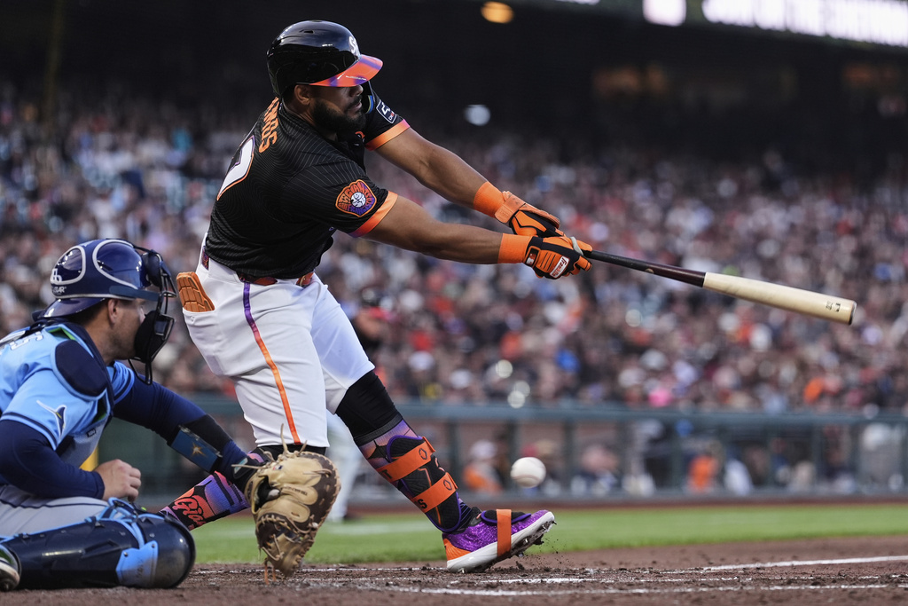 San Francisco Giants' Heliot Ramos strikes out during the fifth inning of a baseball game against the Tampa Bay Rays, Saturday, Aug. 16, 2025, in San Francisco. (AP Photo/Godofredo A. Vásquez)