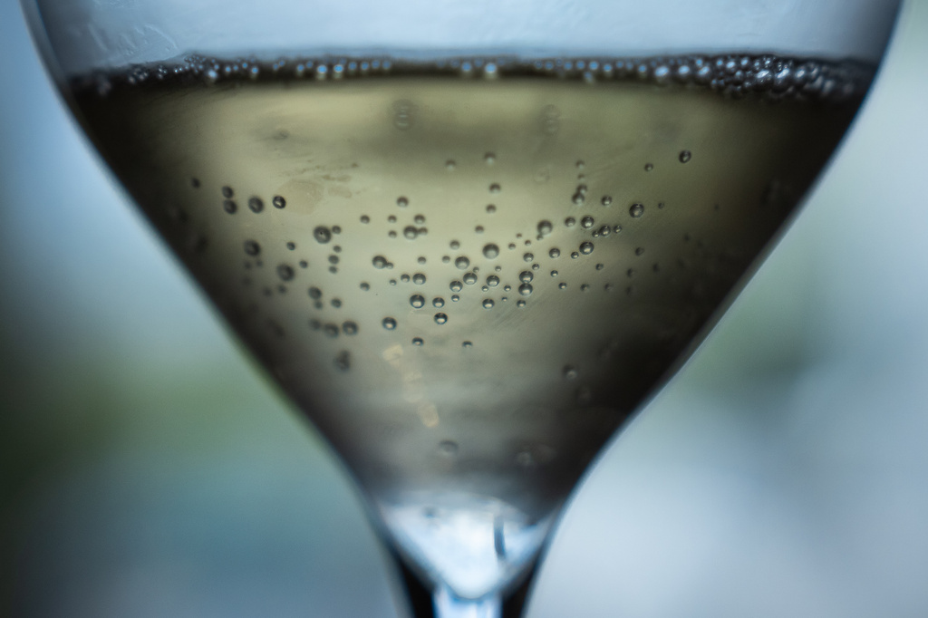 Champagne in a glass is displayed at Gobillard vineyard in Hautvillers, Champagne region, France, Tuesday, Aug. 18, 2026. (AP Photo/Aurelien Morissard)