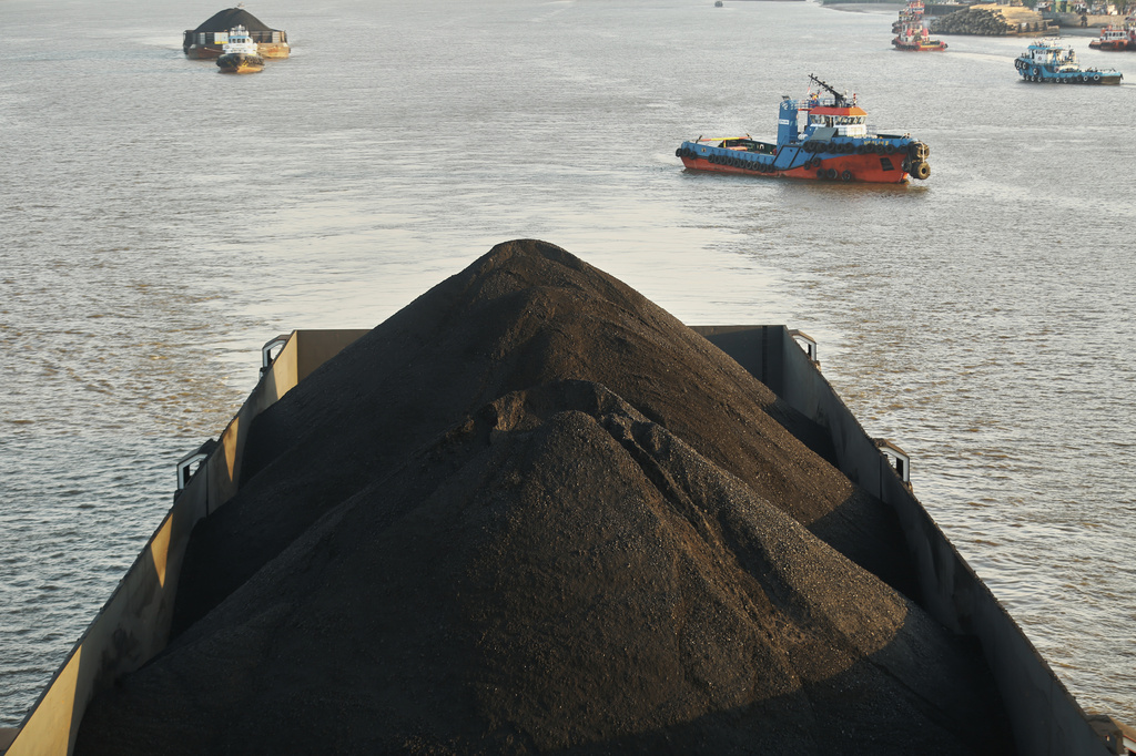 FILE - A barge is fully loaded with coal on the Mahakam River in Samarinda, East Kalimantan, Indonesia, Aug. 19, 2026. (AP Photo/Ahmad Mulia Panjaitan, File)