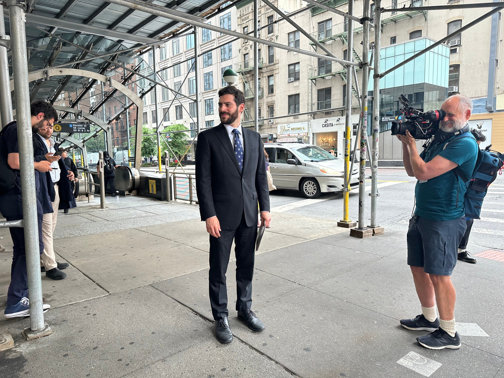 New York Assemblymember Alex Bores campaigns for the Democratic nomination for Congress in New York City on Monday, June 22, 2026. (AP Photo/Anthony Izaguirre)