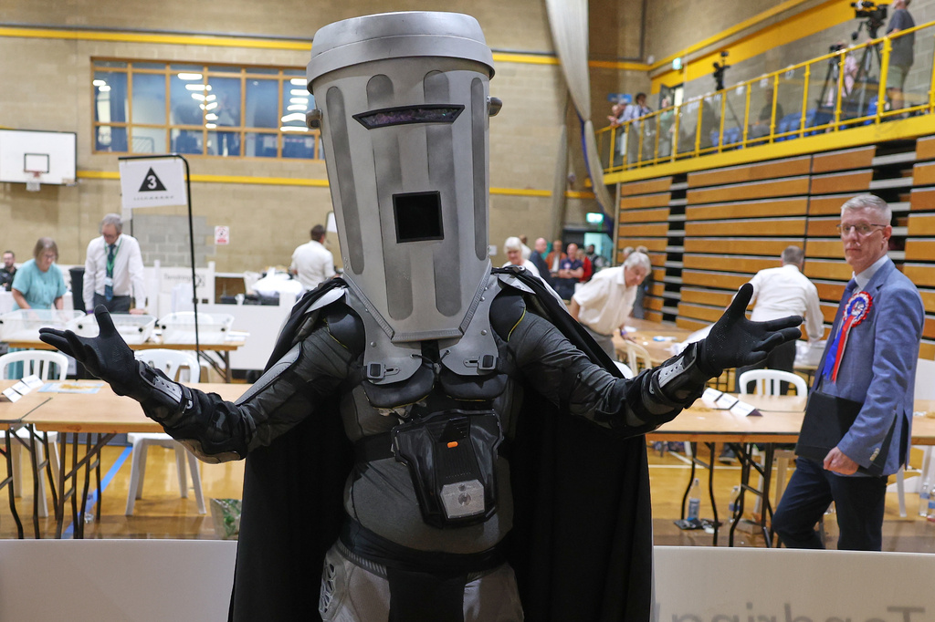 Candidate Count Binface poses for the media during the Clacton by-election count at the Leisure Centre in Clacton on Sea, England, Friday, Aug. 14, 2026.(AP Photo/Richard Pelham)