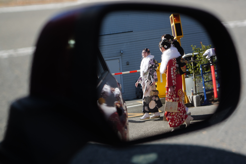 Young adults with kimono walk to celebrate the Coming-of-Age Day, a centuries-old tradition and national holiday marking the milestone from childhood to adulthood, Monday, Jan. 12, 2026, in Yokohama near Tokyo. (AP Photo/Eugene Hoshiko)