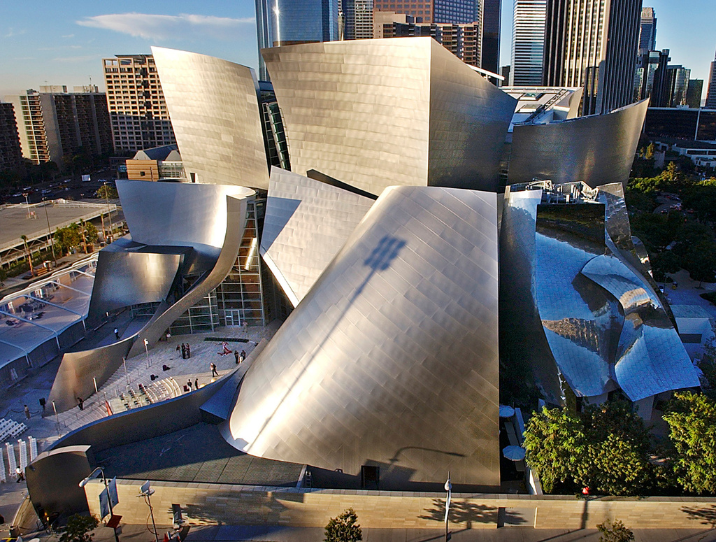 FILE - Early morning sun rays illuminate the Walt Disney Concert Hall designed by Frank Gehry, in downtown Los Angeles, Nov. 19, 2009. (AP Photo/Nick Ut, File)
