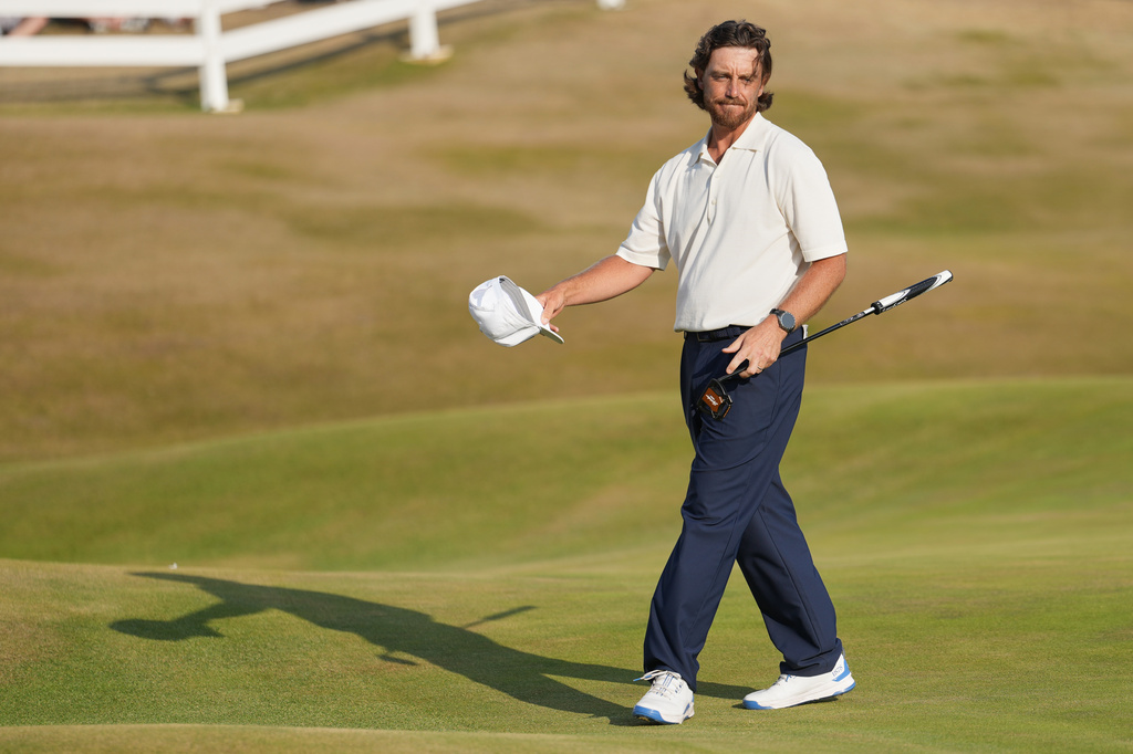 Tommy Fleetwood of England reacts to the crowd on the 18th green after completing his third round during the third day of the British Open Golf championships at Royal Birkdale golf club, in Southport, England, Saturday, July 18, 2026. (AP Photo/Jon Super)