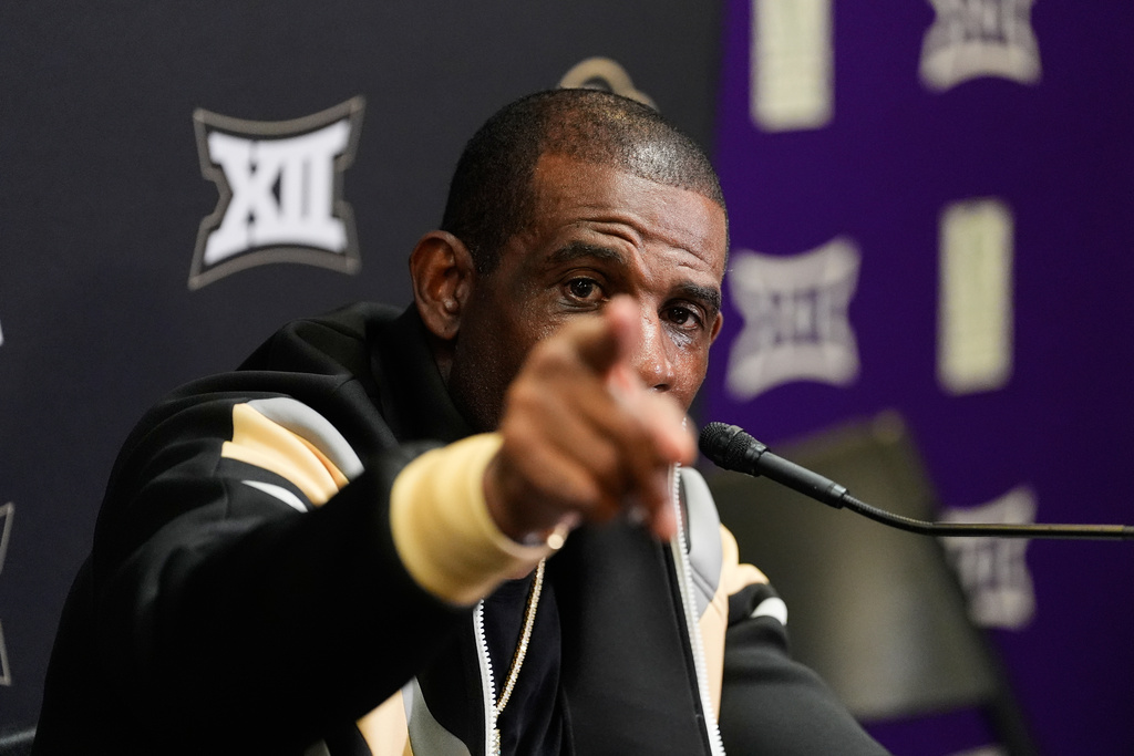 Colorado head coach Deion Sanders points as he responds to a question during a news conference after the team's NCAA college football game against TCU Saturday, Oct. 4, 2025, in Fort Worth, Texas. (AP Photo/Tony Gutierrez)