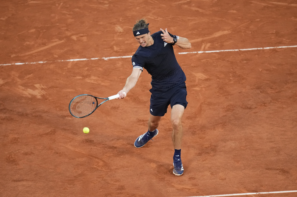 Alexander Zverev of Germany returns to Tomas Machac of the Czech Republic during their second round men's singles tennis match at the French Open tennis tournament in Paris, Wednesday, May 27, 2026. (AP Photo/Christophe Ena)