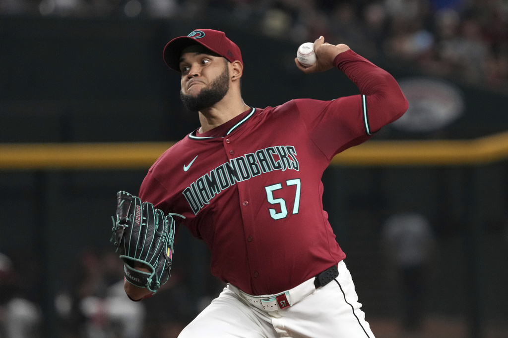 Arizona Diamondbacks pitcher Eduardo Rodriguez throws against the Philadelphia Phillies in the first inning of a baseball game, Sunday, Sept. 21, 2025, in Phoenix. (AP Photo/Rick Scuteri)
