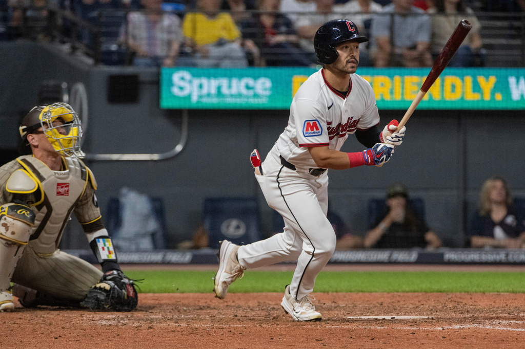 Cleveland Guardians' Steven Kwan watches his RBI double off San Diego Padres starting pitcher Randy Vasquez as catcher Freddy Fermin looks on during the fifth inning of a baseball game, Saturday, Aug. 15, 2026, in Cleveland. (AP Photo/Phil Long)