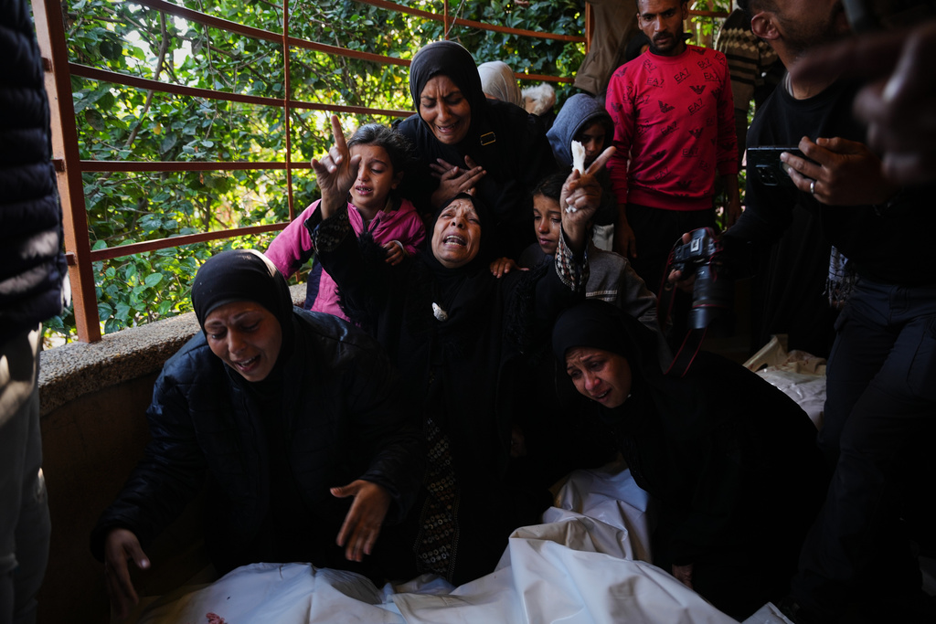 Mourners attend the funeral of Palestinians killed in an Israeli military strike, at Nasser Hospital in Khan Younis, Gaza Strip, Thursday, Dec. 4, 2025. (AP Photo/Abdel Kareem Hana)