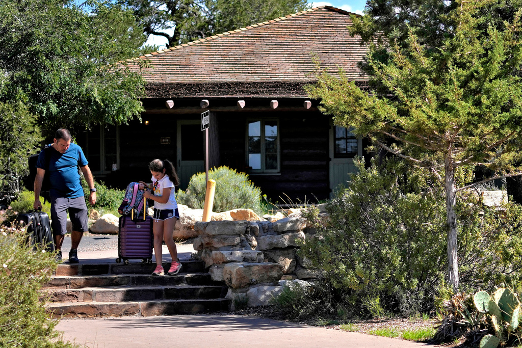 FILE - Guests exit Bright Angel Lodge on Thursday, Aug. 29, 2024, in Grand Canyon, Ariz. (AP Photo/Matt York, File)