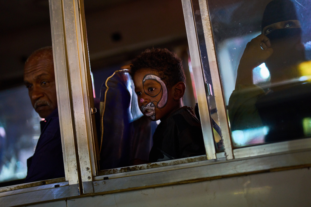 A child sits inside a bus, in Omdurman, Sudan, on the outskirts of Khartoum, Tuesday, April 21, 2026. (AP Photo/Bernat Armangue)