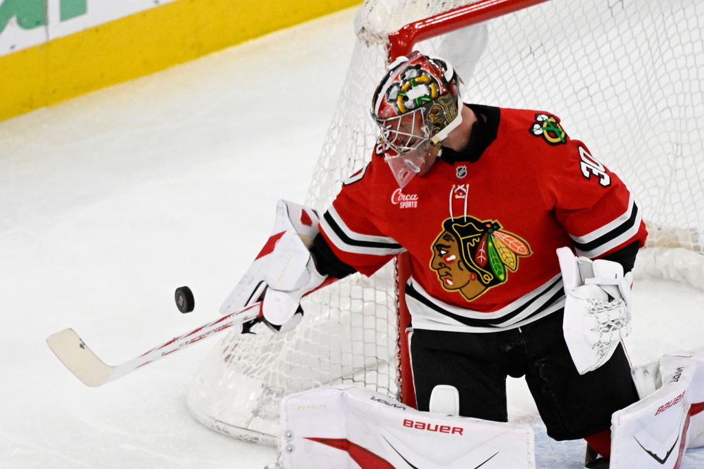 Chicago Blackhawks goaltender Spencer Knight defends against the Edmonton Oilers during the second period of an NHL hockey game, Monday, Jan. 12, 2026, in Chicago. (AP Photo/Matt Marton)