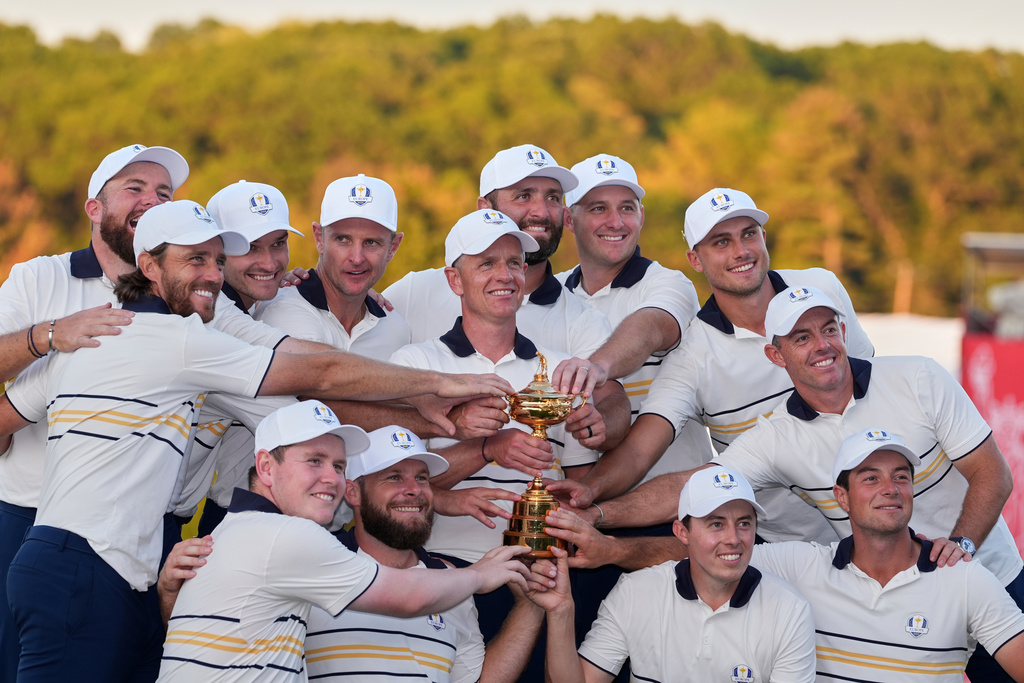 Europe poses with the trophy after winning the Ryder Cup golf tournament against the United States on the Bethpage Black golf course, Sunday, Sept. 28, 2025, in Farmingdale, N.Y. (AP Photo/Lindsey Wasson)