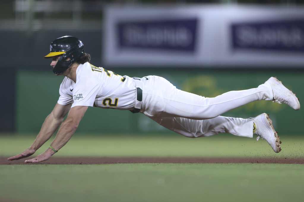 Athletics' Colby Thomas slides into second base safely during the eighth inning of a baseball game against the Tampa Bay Rays, Tuesday, Aug. 12, 2025, in West Sacramento, Calif. (AP Photo/Scott Marshall)