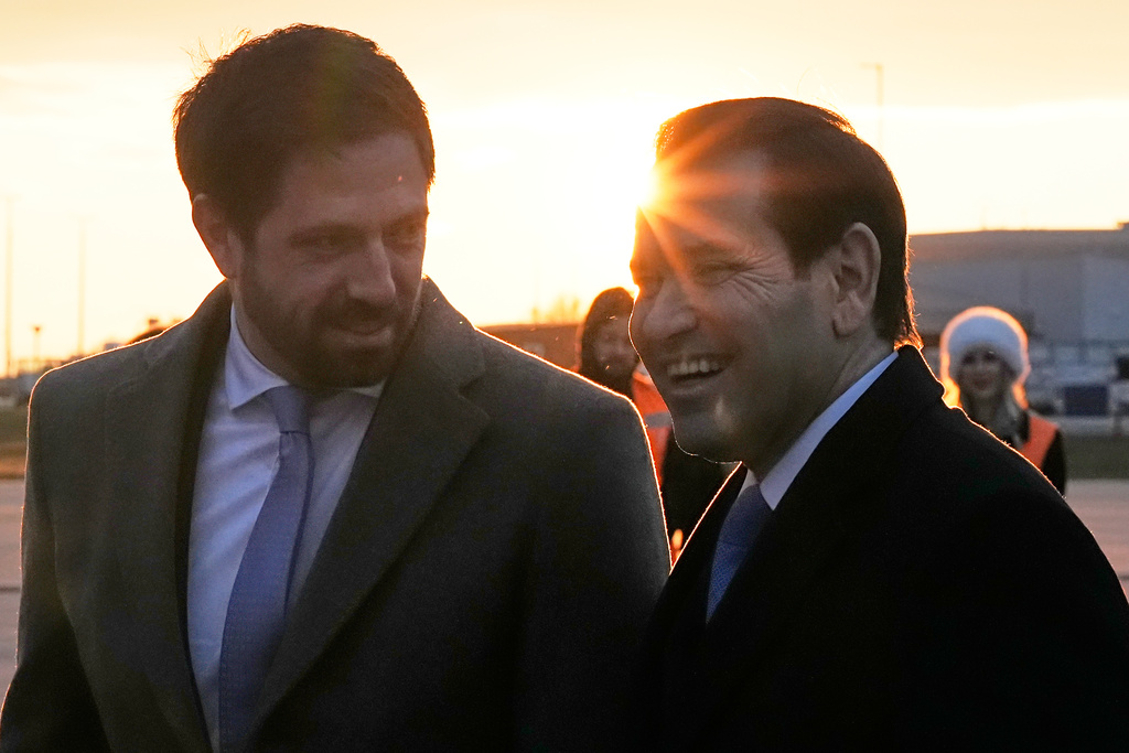 U.S. Secretary of State Marco Rubio speaks to Hungary's Deputy Foreign Minister Levente Magyar, left, upon landing at the Liszt Ferenc International Airport in Budapest, Hungary, Sunday, Feb. 15, 2026. (AP Photo/Alex Brandon, Pool)