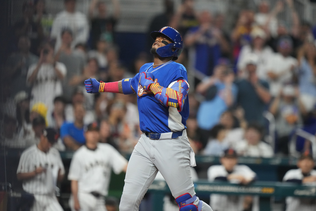 Venezuela's Ronald Acuna Jr. celebrates his single home run during the first inning of a World Baseball Classic quarterfinal game, Saturday, March 14, 2026, in Miami. (AP Photo/Lynne Sladky)
