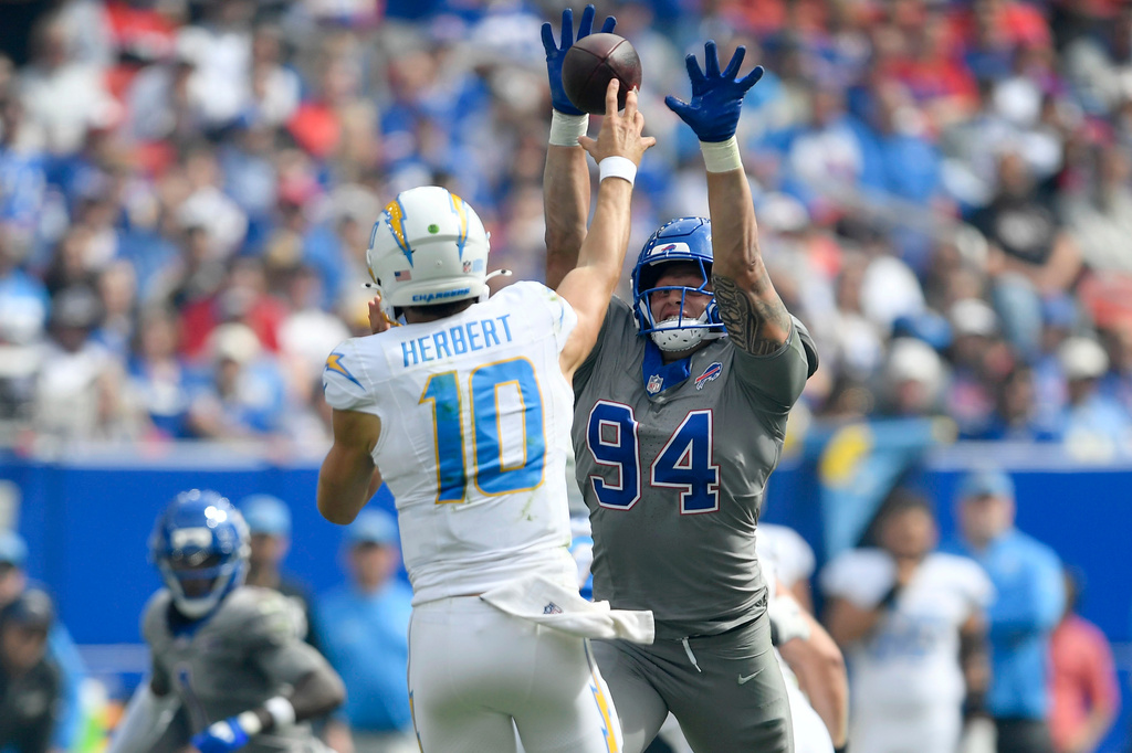 Buffalo Bills defensive end Landon Jackson (94) pressures Los Angeles Chargers quarterback Justin Herbert (10) during the first half of an NFL football game, Sunday, Sept. 27, 2026, in Orchard Park, N.Y. (AP Photo/Adrian Kraus)