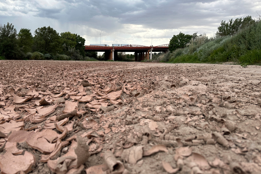 Traffic crosses a bridge over the dry Rio Grande along Interstate 40 in Albuquerque, N.M., on Thursday, Aug. 21, 2025. (AP Photo/Susan Montoya Bryan)