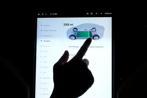 FILE - The charging status screen is shown on a Tesla car at a home in San Francisco, Aug. 25, 2022. (AP Photo/Jeff Chiu, File) FILE - The charging status screen is shown on a Tesla car at a home in San Francisco, Aug. 25, 2022. (AP Photo/Jeff Chiu, File)
