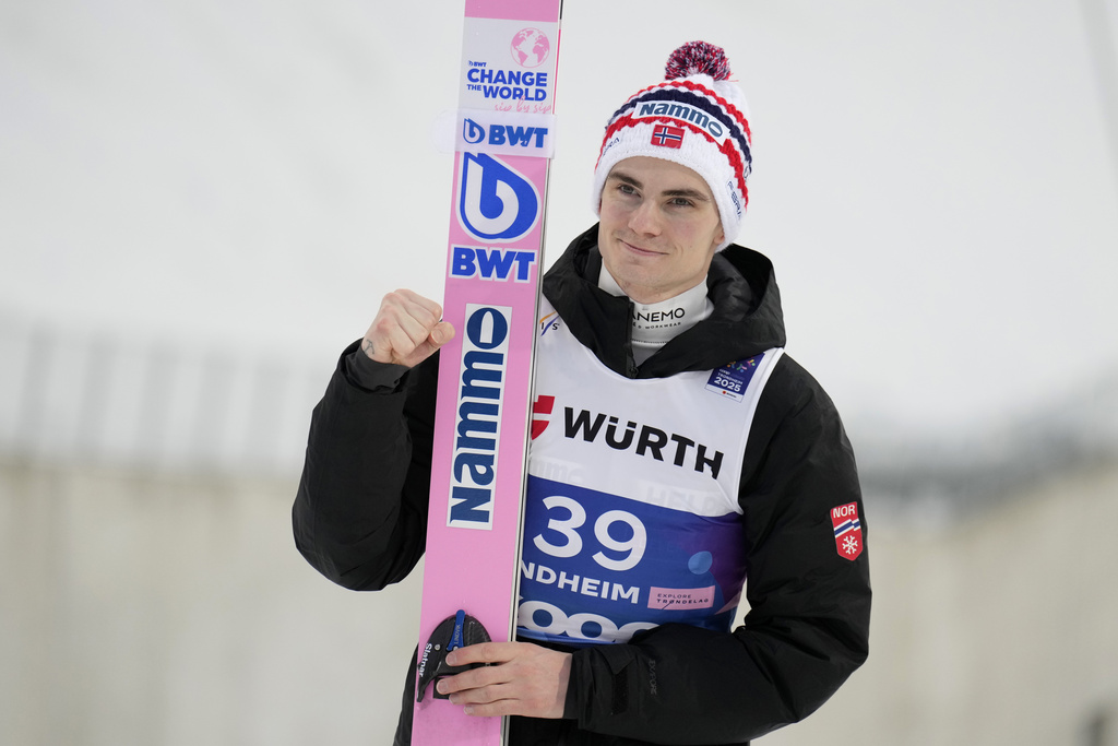 FILE - Marius Lindvik, of Norway, poses after winning the silver medal in the ski jumping men's large hill individual competition at the Nordic World Ski Championships in Trondheim, Norway, March 8, 2025. (AP Photo/Matthias Schrader, file)