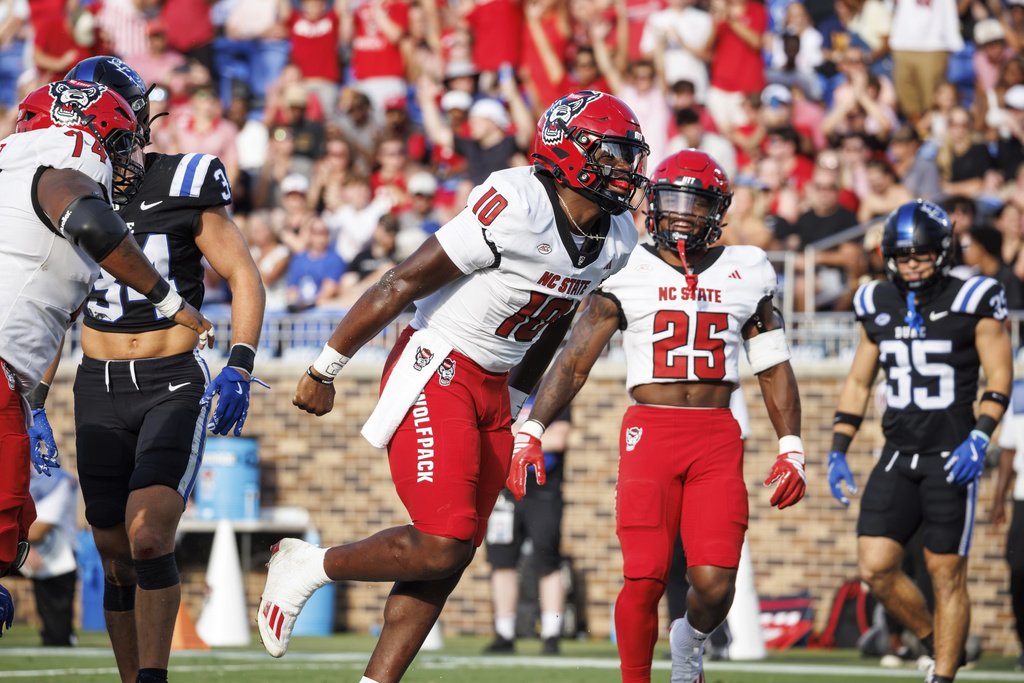 North Carolina State's Will Wilson (10) celebrates after scoring a touchdown against Duke during an NCAA college football game in Durham, N.C., Saturday, Sept. 20, 2025. (AP Photo/Ben McKeown)