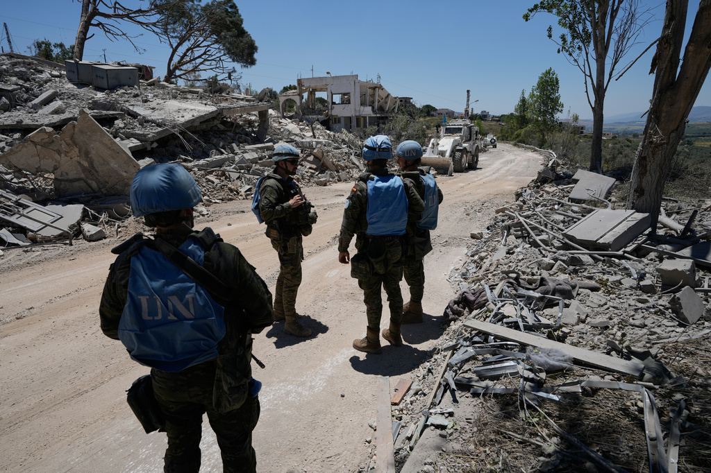 Spanish U.N peacekeepers deploy at a road in Dibbine village, southeast Lebanon, Friday, June 5, 2026, a day after Israeli forces withdrew following intense clashes with Hezbollah fighters. (AP Photo/Hussein Malla)