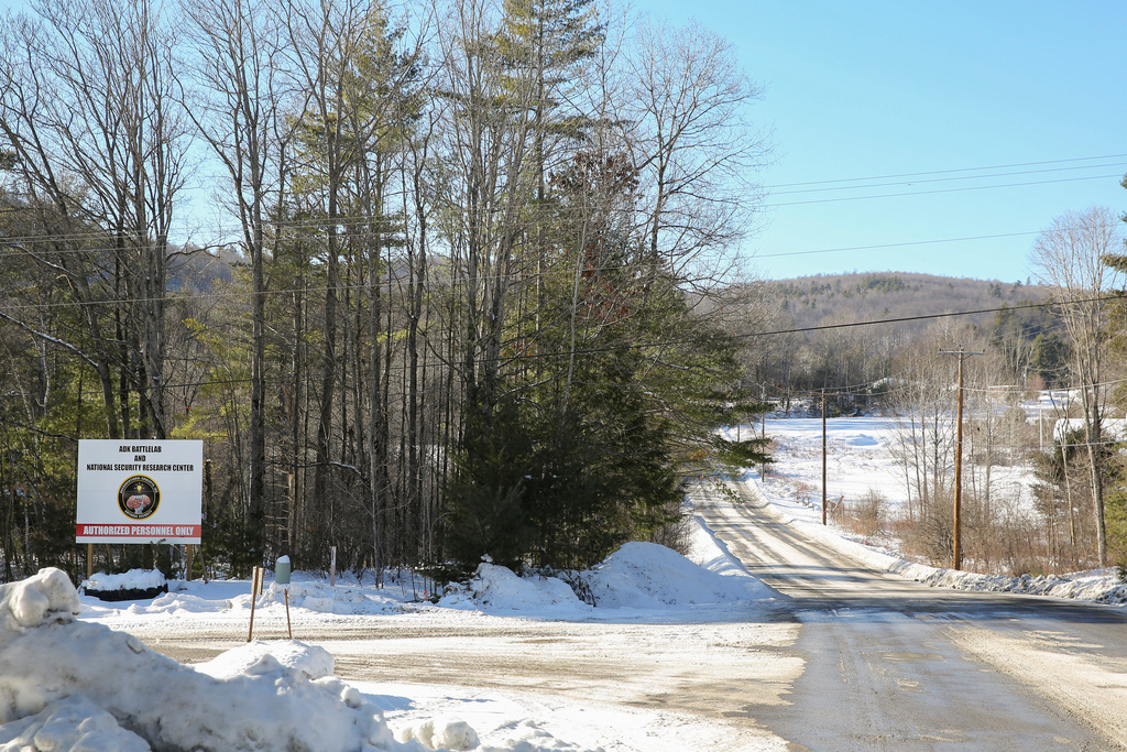 A sign sits off a road where a private contractor has proposed a howitzer testing, Monday, Feb. 2, 2026, in Lewis, N.Y. (AP Photo/Michael Hill)