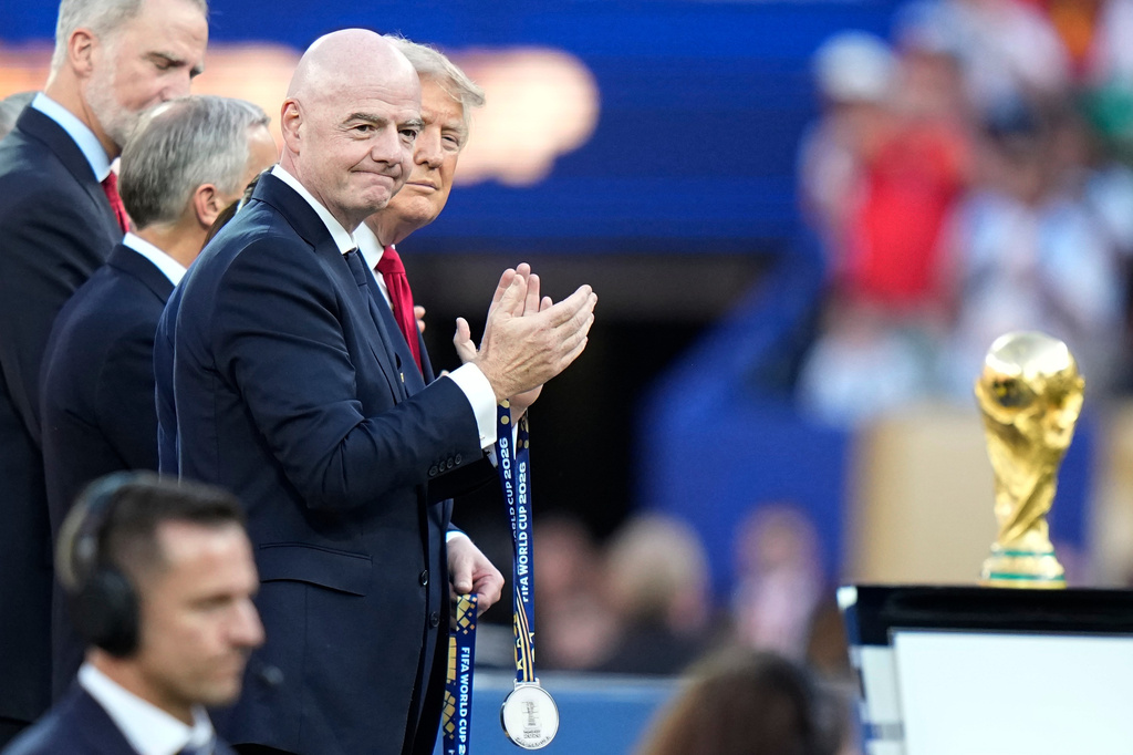 U.S. President Donald J. Trump and FIFA President Gianni Infantino applaud to welcome the players during the presentation ceremony after the World Cup final soccer match between Spain and Argentina in East Rutherford, N.J., near New York, Sunday, July 19, 2026. (AP Photo/Frank Franklin II)