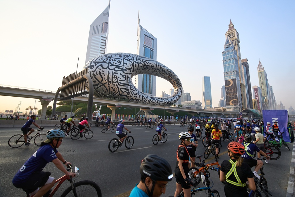 Bicyclists ride along Sheikh Zayed highway during the Dubai Ride annual event in Dubai, United Arab Emirates, Sunday, Nov. 2, 2025. (AP Photo/ Fatima Shbair)