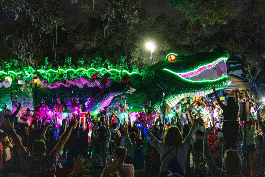 Attendees march during the annual Krewe of Bacchus parade during the Mardi Gras season on Sunday, Feb. 15, 2026, in New Orleans. (Photo by Amy Harris/Invision/AP)