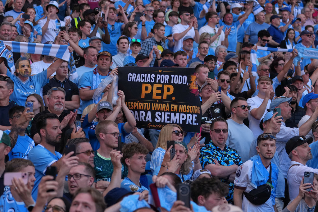 Manchester City fans holds a sign thanking the coach Pep Guardiola during his last macth as a manager during a Premier League soccer match between Manchester City and Aston Villa in Manchester, England, Sunday, May 24, 2026. (AP Photo/Alastair Grant)