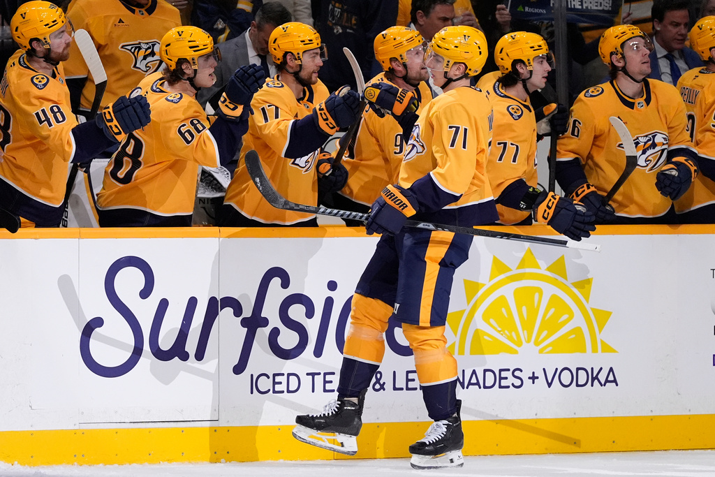 Nashville Predators right wing Matthew Wood (71) celebrates his goal with teammates during the first period of an NHL hockey game against the San Jose Sharks, Tuesday, March 24, 2026, in Nashville, Tenn. (AP Photo/George Walker IV)