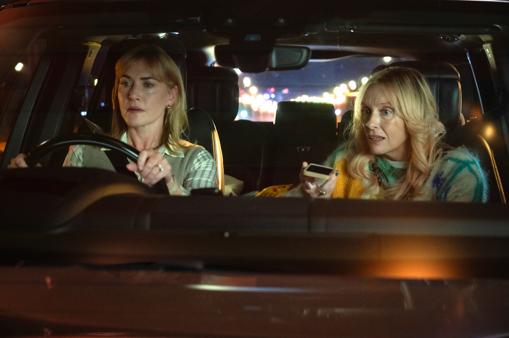 This image released by Netflix shows Kate Winslet, left, and Toni Colette in a scene from "Goodbye June." (Netflix via AP)