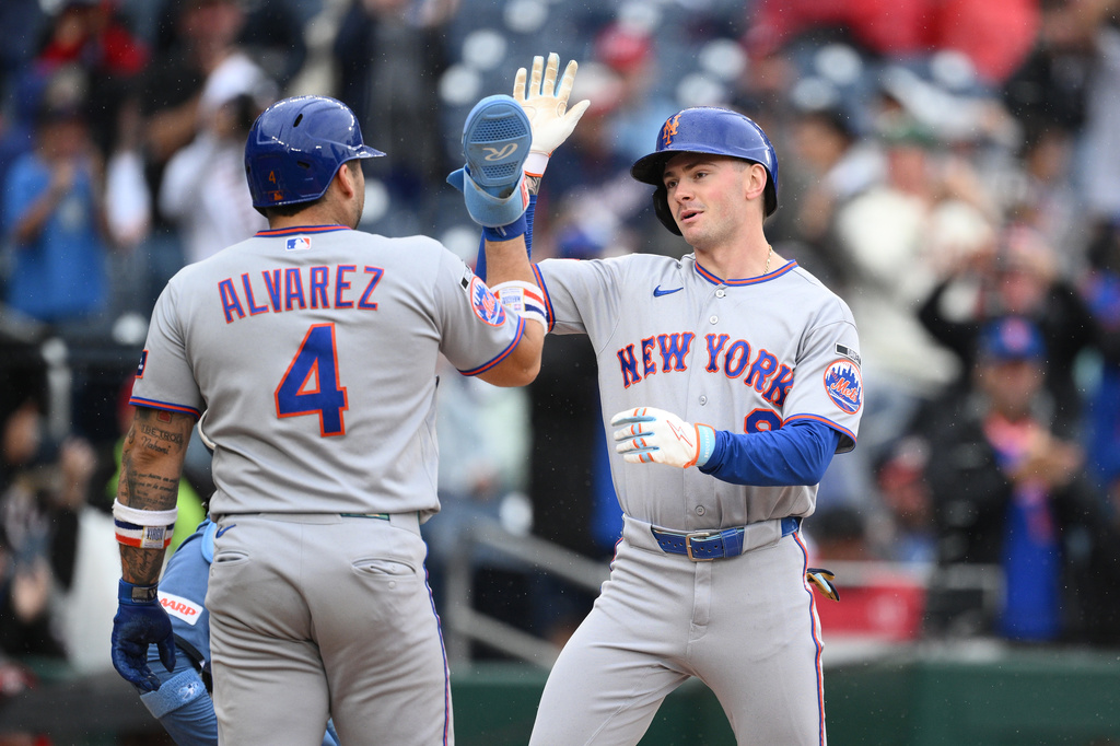 New York Mets' A.J. Ewing, right, celebrates his three-run home run with Francisco Alvarez (4) during the seventh inning of a baseball game against the Washington Nationals, Saturday, Sept. 26, 2026, in Washington. (AP Photo/Nick Wass)